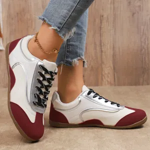 Stylish women's color-block T-toe sneakers with burgundy accents and soft rubber sole