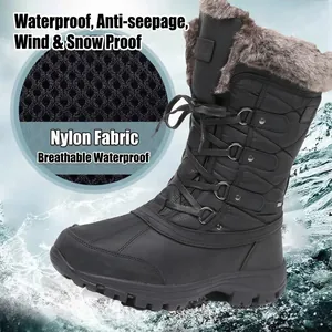 Botas de nieve altas negras impermeables con forro cálido de piel sintética y cordones.