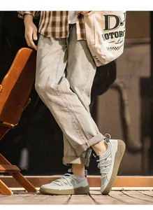 Men's retro low-top breathable sneakers shown in a casual outdoor lifestyle setting.