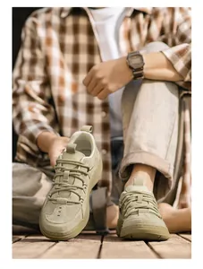 Close-up of beige men's retro German army trainers with breathable mesh and soft soles