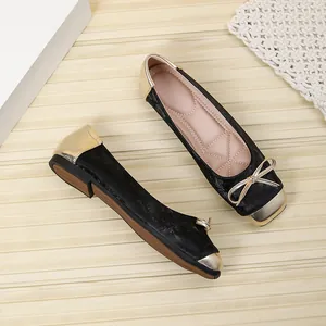 Elegant black and gold patchwork square toe ballet flats with delicate bow detail and soft sole