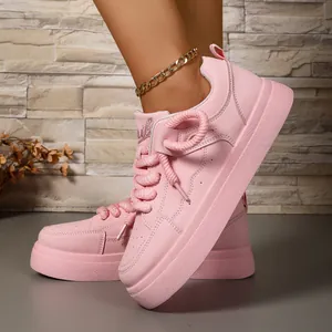 Detailed side view of pink chunky platform sneakers for women with stylish rope laces