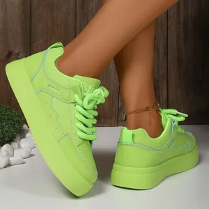 Stylish side view of neon green platform sneakers featuring thick rope laces