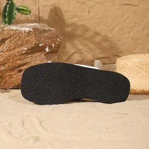 Close-up detail of the textured anti-slip outsole on these women's square-toe flip-flops