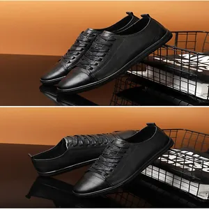 Close-up detail of premium black textured leather sneakers for men with lace-up design