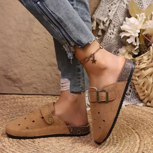 Retro brown suede closed-toe mules with buckle strap and platform cork sole detail