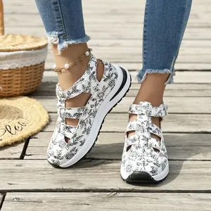 Floral print platform wedge sandals for women worn on sunny wooden deck outdoor