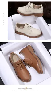 Close-up detail of versatile women's casual leather loafers in beige and brown colors