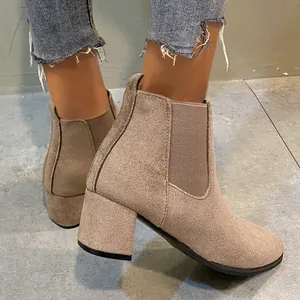 Side view detail of women's khaki suede Chelsea boots with a stable chunky block heel.