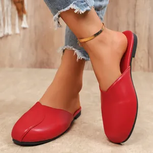 Stylish red flat closed-toe mules for women featuring a comfortable round toe design
