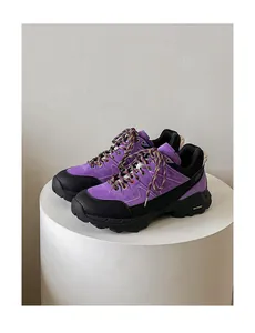 Vibrant purple suede hiking shoes with thick black anti-slip soles for outdoor trekking