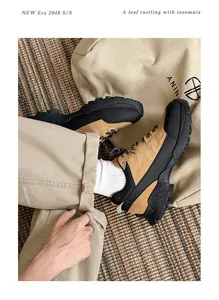 Close-up of khaki outdoor hiking shoes with chunky black soles in a lifestyle setting