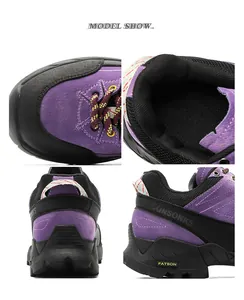 Detail view of purple hiking shoes showing breathable lining and rugged sole texture