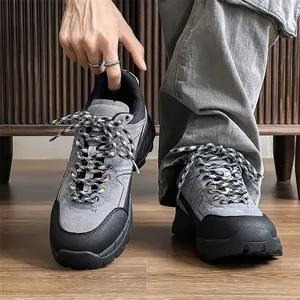 Grey and black men's hiking shoes featuring a chunky non-slip sole for outdoor trekking