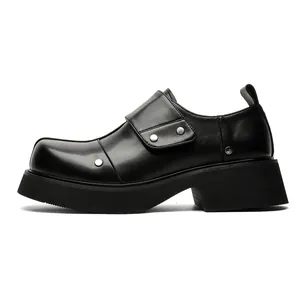 Side view of black platform leather men's shoes with silver rivet details and wide strap