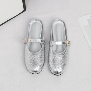 Elegant silver woven round-toe flat mules with a stylish heart-shaped buckle strap