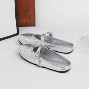 Chic silver woven Mary Jane flat mules with elegant heart buckle detail
