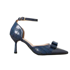 Elegant navy blue pointed-toe stiletto heels with ankle strap and decorative bow detail.