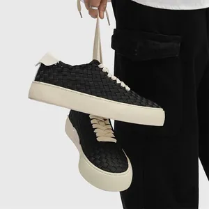 Hand-woven black low-top sneakers with white rubber soles for men's casual wear