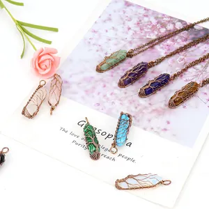 Close-up of wire wrapped Tree of Life natural hexagonal crystal pendants in various colors
