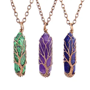 Macro view of three vintage hand-wound Tree of Life necklaces with hexagonal crystal pillars
