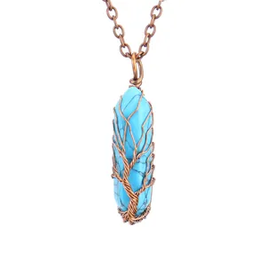 Detailed macro view of handmade copper wire-wrapped Tree of Life design on turquoise pendant