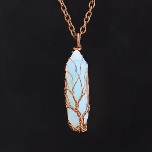 Close-up of vintage handmade wire-wrapped hexagonal crystal tree of life necklace
