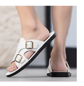 Detailed side view of stylish white double-buckle leather slides for summer comfort