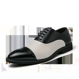 Vista dettagliata di scarpe stringate bicolore uomo in pelle nera e bianca traforata
