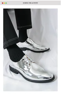 Detailed view of men's silver shiny metallic dress shoes with classic pointed toe design