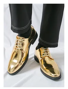 Close-up detail of shiny gold metallic men's dress shoes with glossy mirror finish