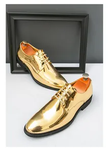 Detailed view of shiny gold metallic men's pointed toe dress shoes for formal wear