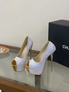 Close-up of sparkly glitter peep toe pumps with gold platform and stiletto heels for women