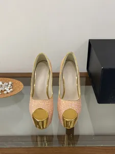 Detailed view of pink sequin peep-toe platform high heels with gold accents