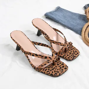 Stylish leopard print thong high heel sandals with square toe and slim kitten heel.