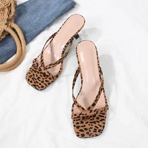 Detail view of leopard print square toe thong sandals with stiletto heels for summer