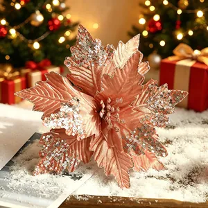 Élégante fleur de Noël artificielle rose doré à paillettes pour la décoration de votre sapin.