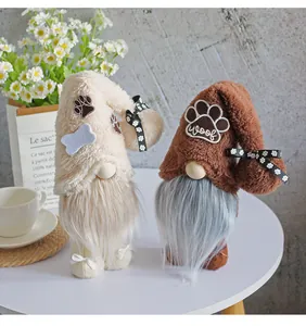 Pair of plush faceless gnome dolls with dog-themed patterns for holiday home decor.