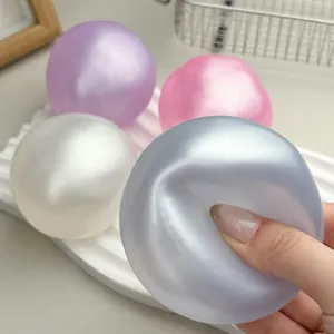 Handmade pearlescent squishy stress relief balls in assorted pastel colors for relaxation