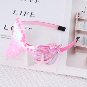 Adorable pink sequined mermaid tail headband featuring iridescent shell and starfish details