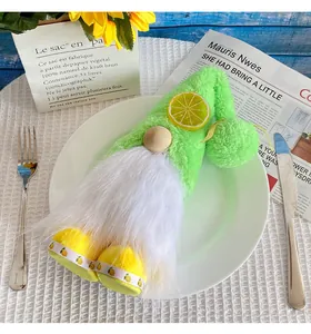 Detailed view of a green lemon-themed plush gnome doll placed on a white ceramic plate