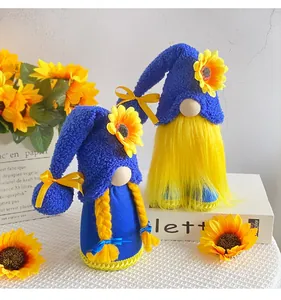 Handmade plush sunflower gnomes in blue and yellow colors for festive table decor.