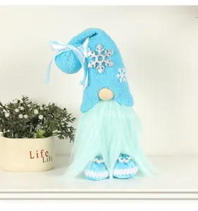 Blue plush Christmas gnome with snowflake hat and mint green beard on white shelf