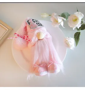 Handmade pink plush gnome doll with Fight Cancer patch for home desktop decoration