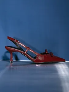 Elegant wine red slingback heels featuring a double bow accent and a pointed toe design.