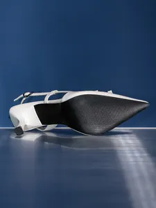 Close-up detail of the black non-slip sole and heel of a white slingback pump shoe