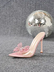 Pink stiletto heels with clear PVC strap and large rhinestone butterfly detail