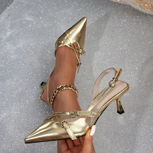 Elegant gold pointed toe high heels with double buckles and slingback stiletto design.