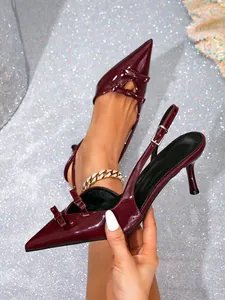 Elegant burgundy pointed-toe high heels with double bow and slingback strap detail.