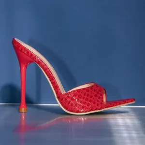 Elegant red crocodile skin stiletto high heel mules with open toe and slim heel profile